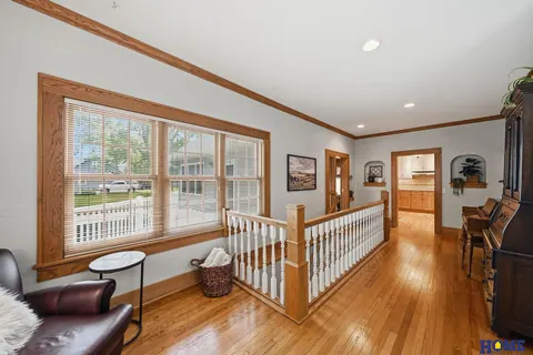 207 W 4th Street: front of the main floor: wood floors, oak trim and an open stair rail