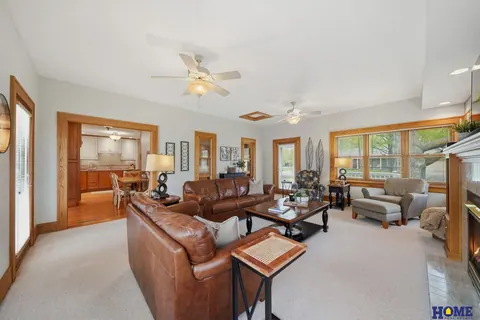207 W 4th Street: living room with two ceiling fans and big windows