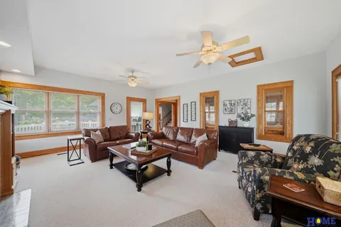 207 W 4th Street: living room with windows on two walls