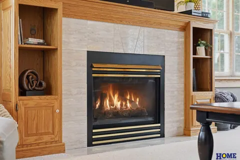 207 W 4th Street: living room fireplace with tile surround between oak built-in shelves