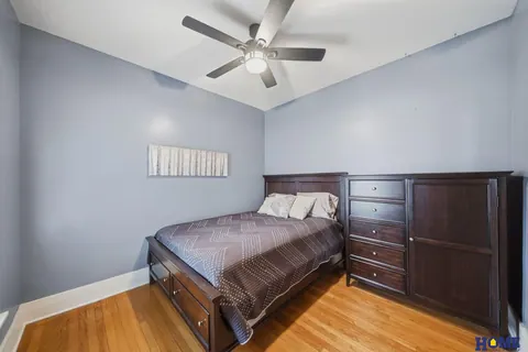 207 W 4th Street: main-floor bedroom with wood floors