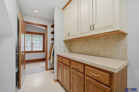 207 W 4th Street: built-in cabinets and counter, white uppers and oak lowers