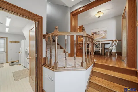 207 W 4th Street: back entry landing with steps and oak trim