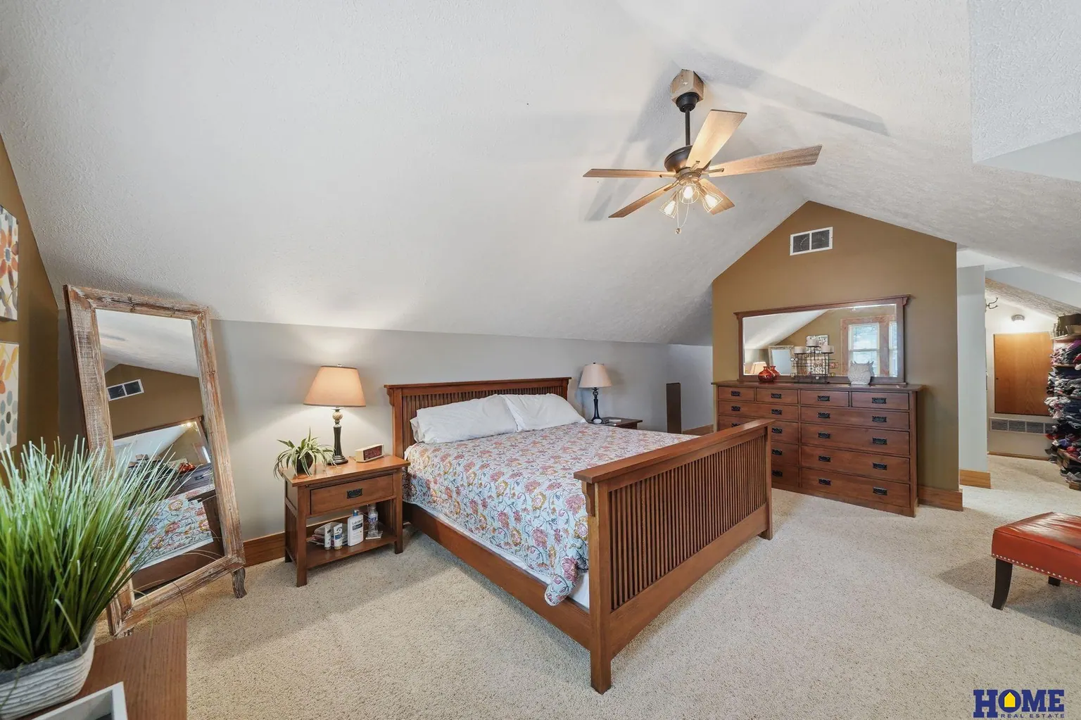 207 W 4th Street: primary bedroom, wide view under the vaulted ceiling