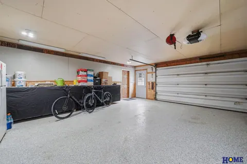 207 W 4th Street: attached garage interior with workspace