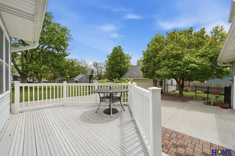 207 W 4th Street: back deck overlooking the yard and trees, photo 57