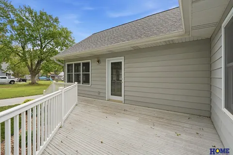 207 W 4th Street: back deck with white railings